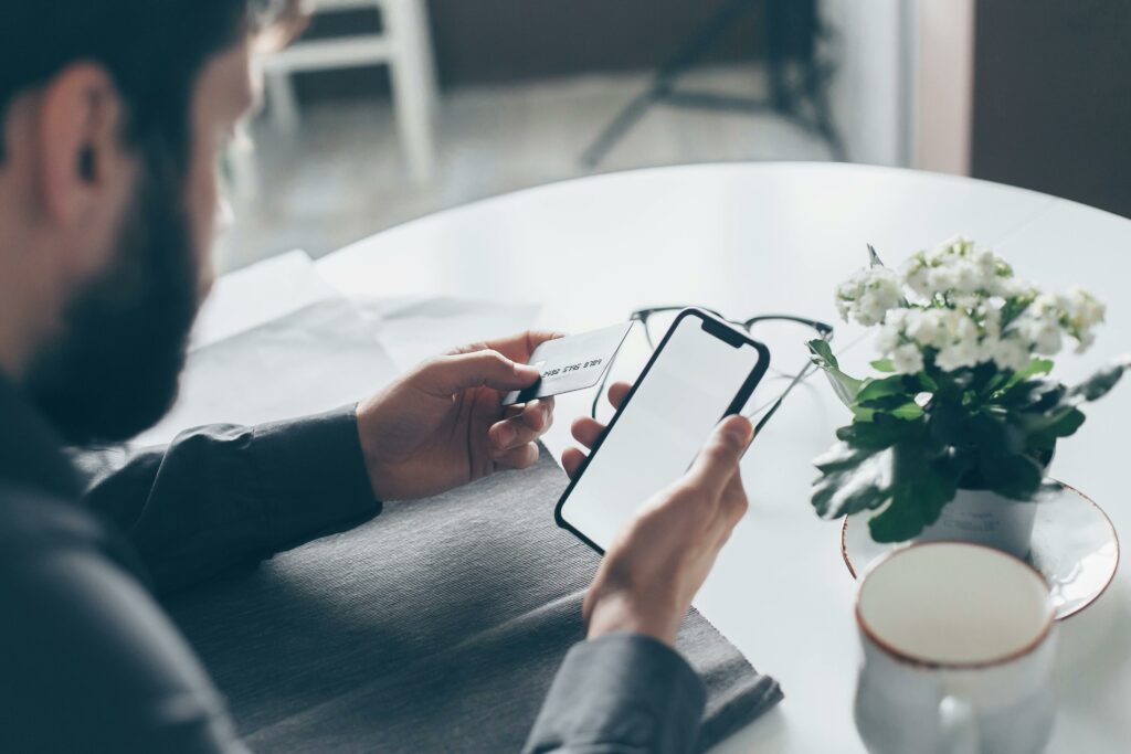 Smartphone displaying a banking app and a social media icon
