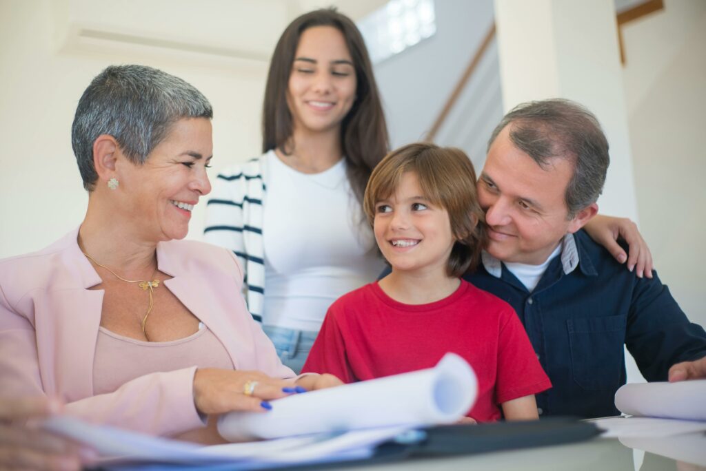 "Happy family with two children engaging with a conveyancer during a property transaction.