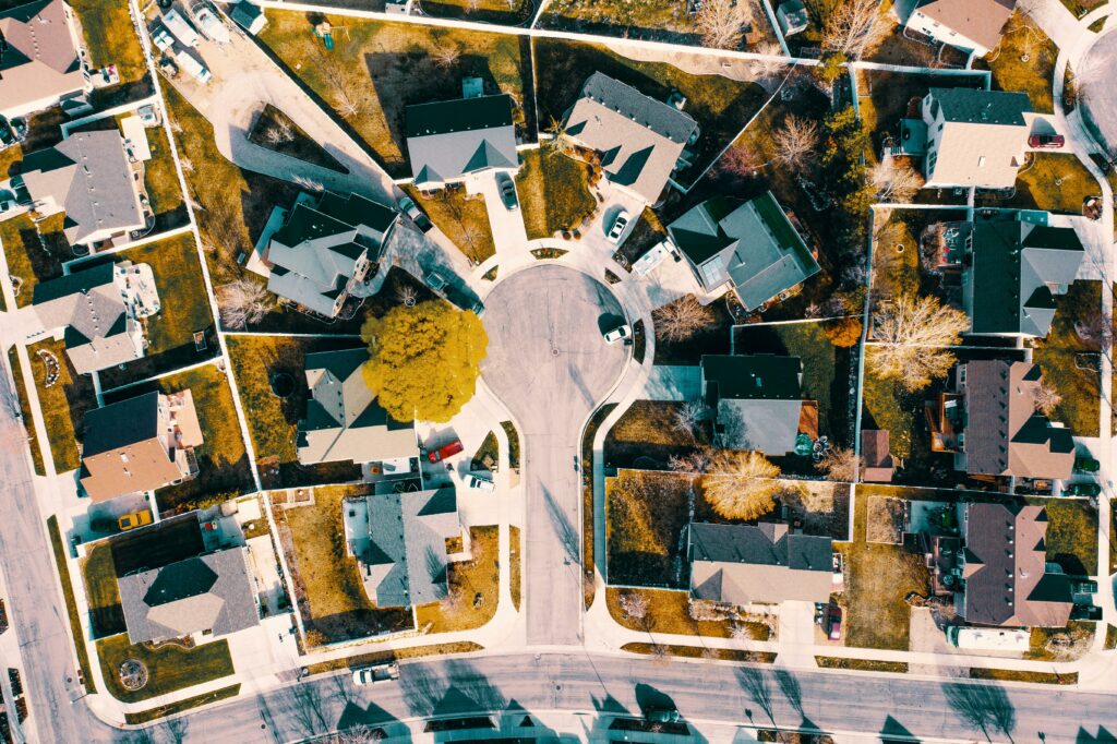 Aerial view of a suburban neighborhood in Australia illustrating residential housing, representing the stability and predictability offered by 5-Year Fixed Home Loan Rates in Australia.
